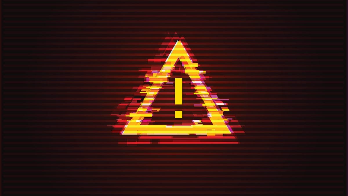 Un panneau d'avertissement, tout cassé et déchiqueté