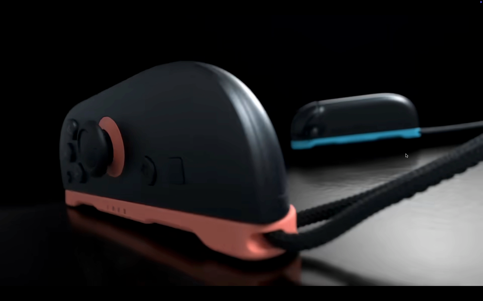 Un gros plan d'un commutateur 2 Joy-Con, attaché à une poignée, positionné sur le côté en mode souris.
