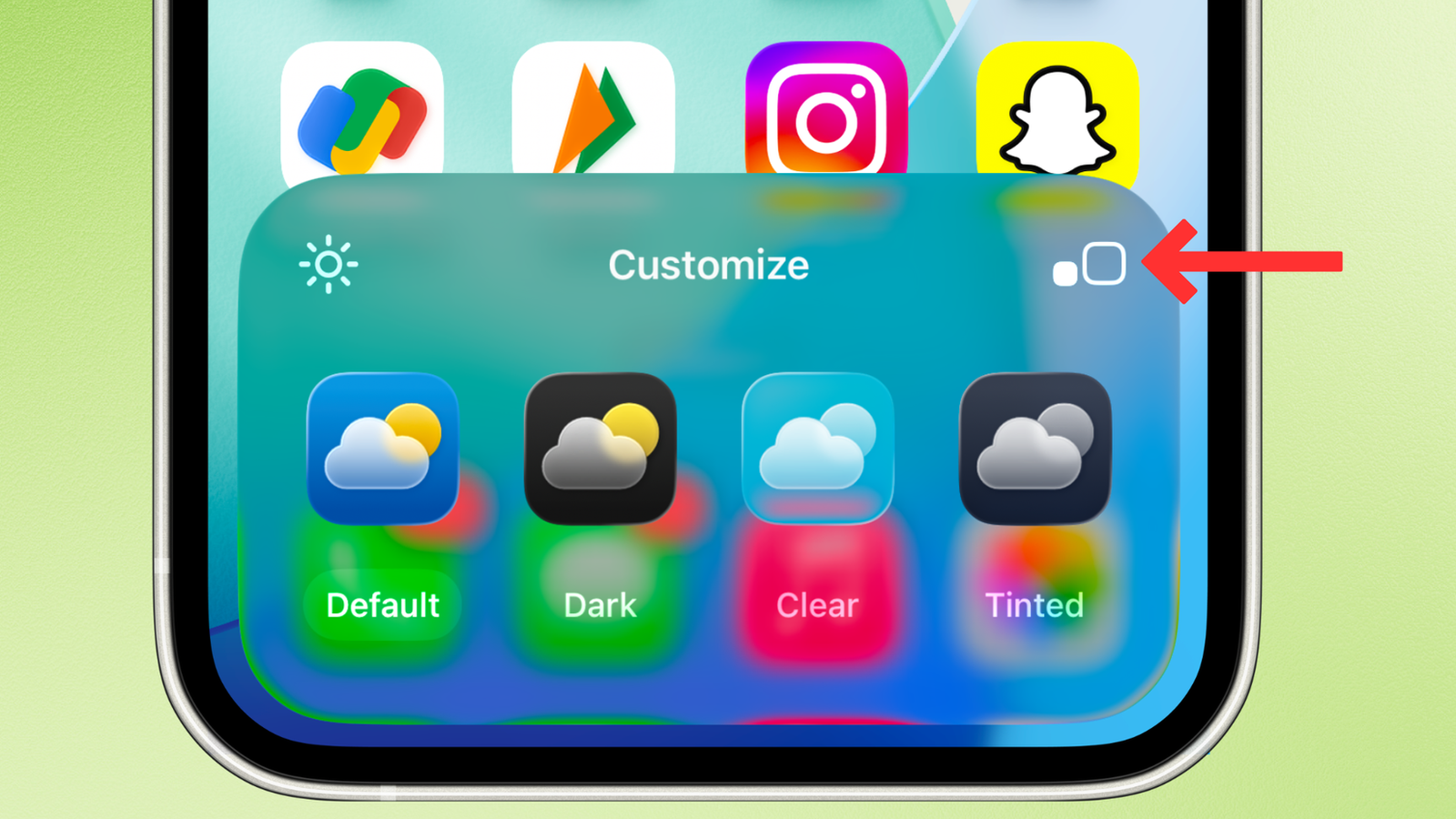 Capture d'écran de l'écran d'accueil de l'iPhone sur iOS 26, avec une flèche à côté du bouton de grandes icônes.