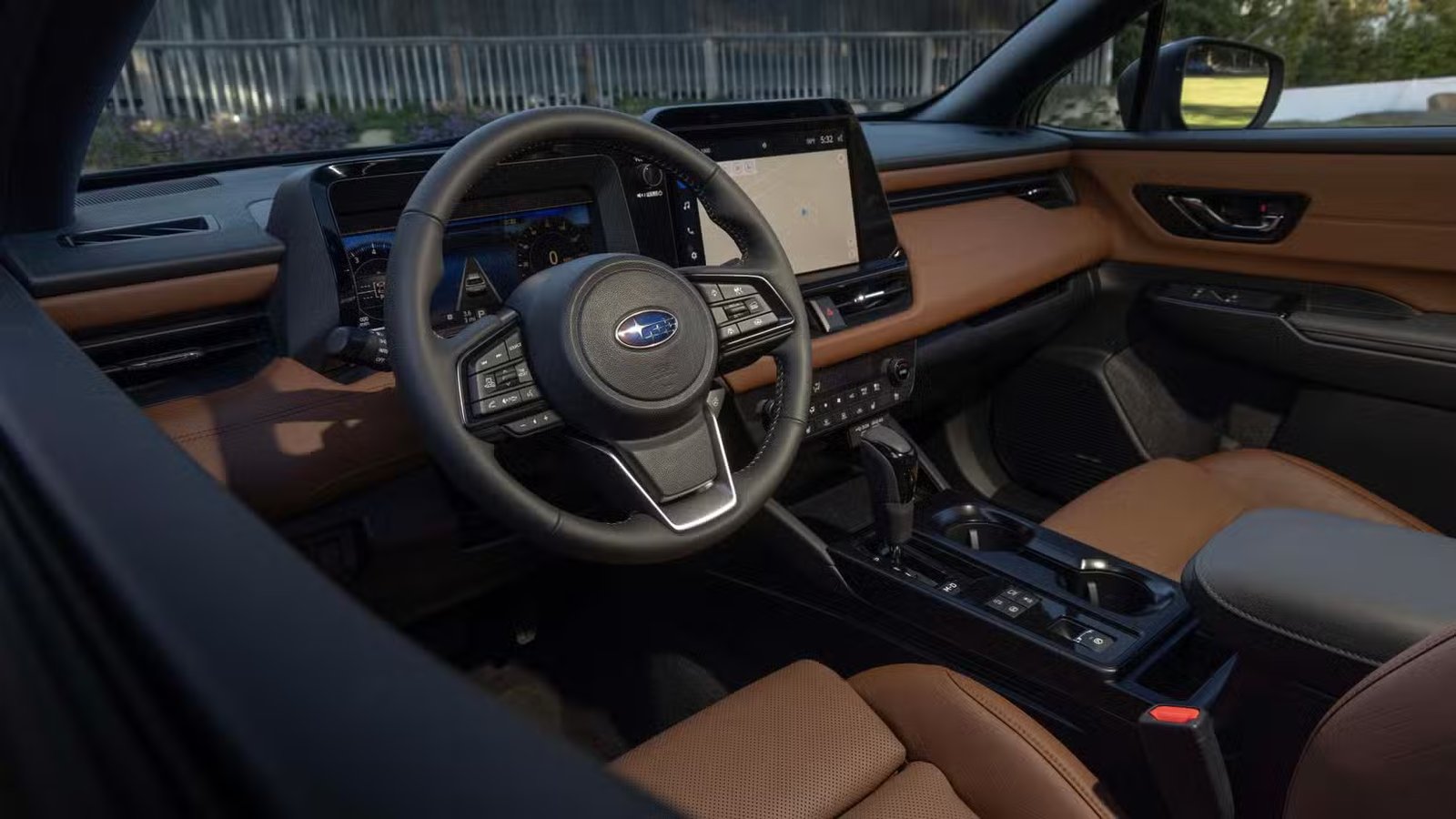 Prise de vue à l'intérieur de l'habitacle d'une Subaru Outback 2026 montrant le volant, le tableau de bord et l'intérieur.