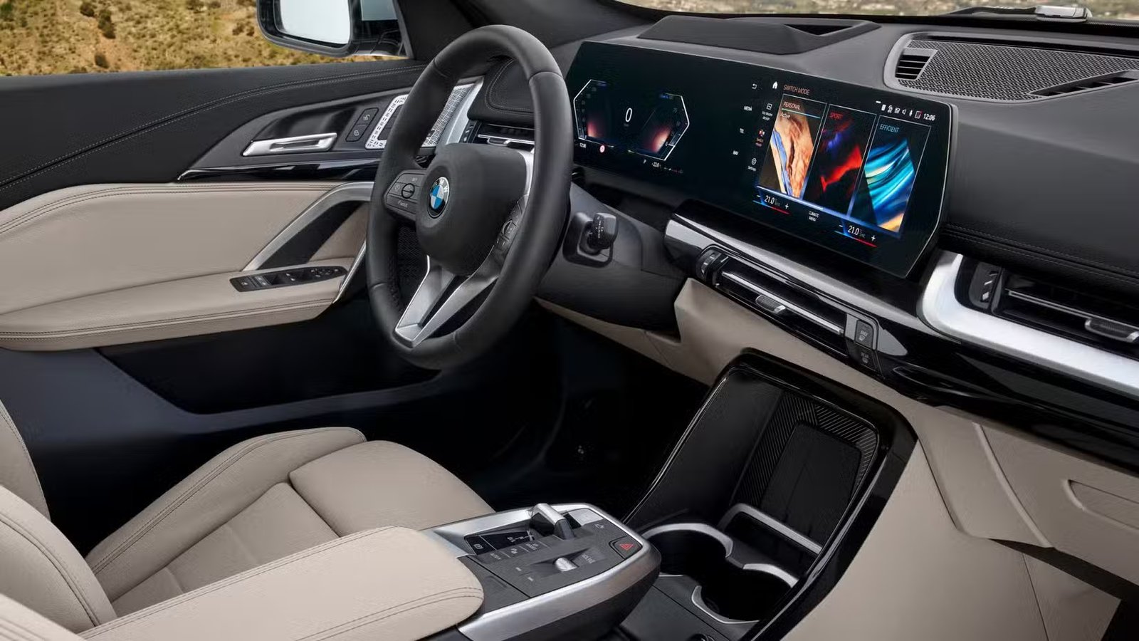 Plan du volant et de l'écran d'infodivertissement d'une BMW X1 2023.