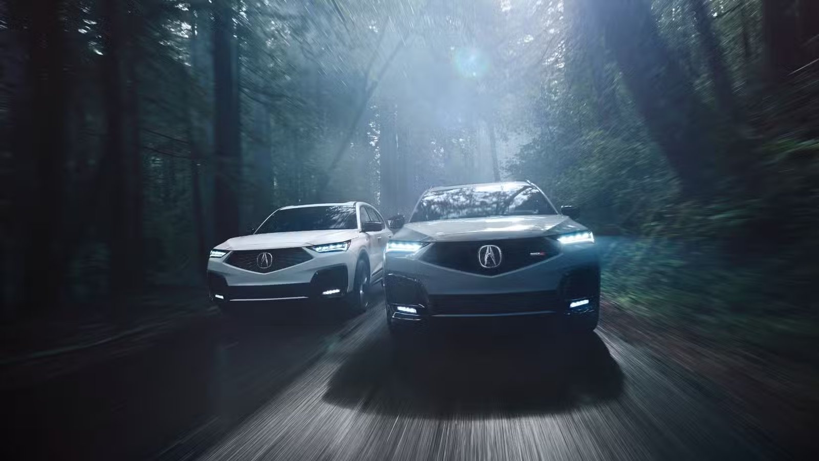 Plan avant dynamique d'une Acura MDX A-Spec 2025 et d'un MDX Type S roulant côte à côte.